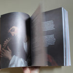 Open Catholic prayer book with traditional prayers and sacred art for daily devotional use
