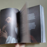 Open Catholic prayer book with traditional prayers and sacred art for daily devotional use
