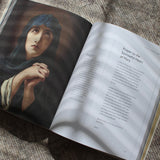 Open Catholic prayer book with prayer to Our Lady of Sorrows