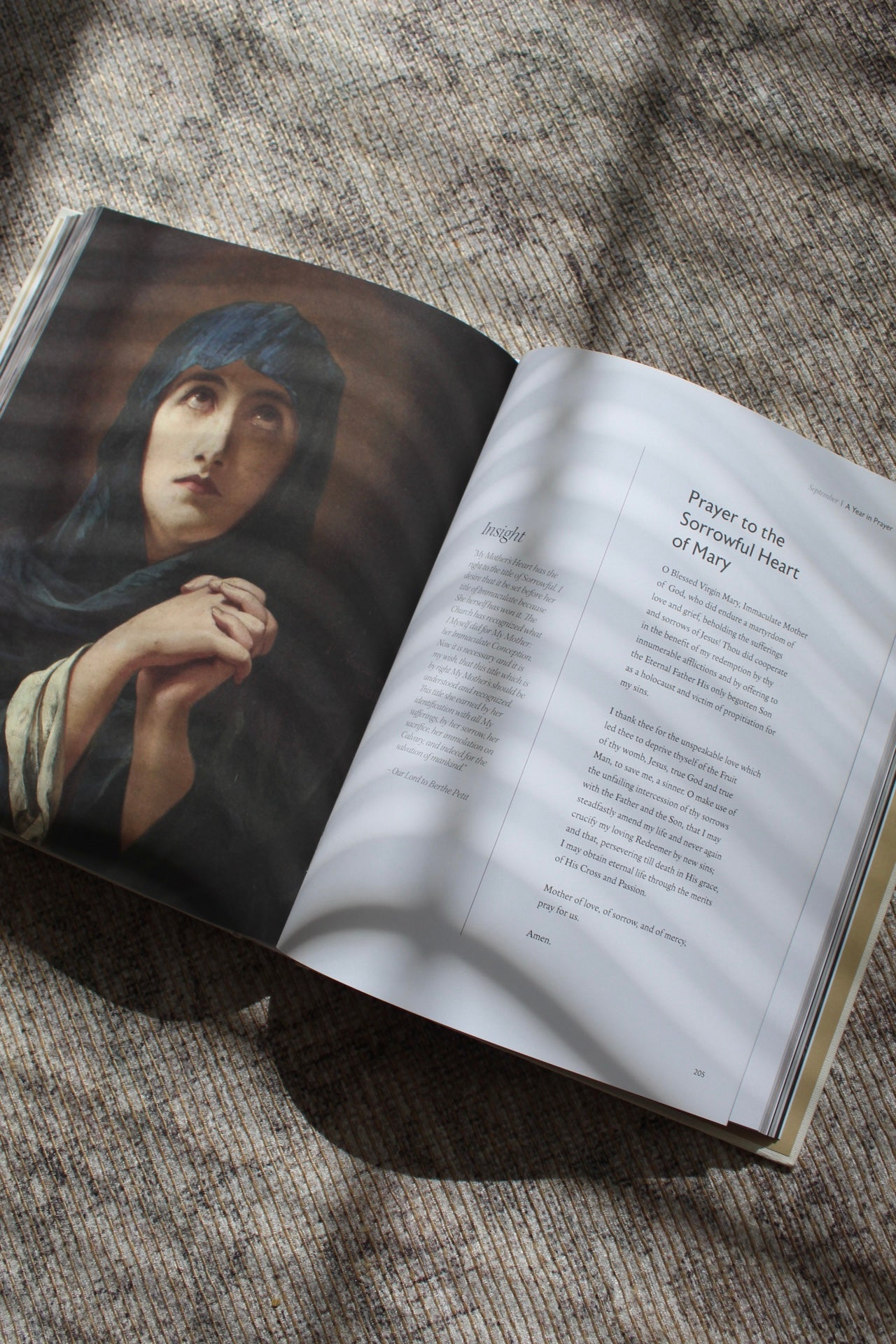 Open Catholic prayer book with prayer to Our Lady of Sorrows