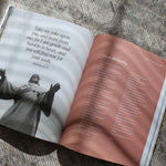 open Catholic prayer book with traditional prayers and reflections from scripture catechism and saints